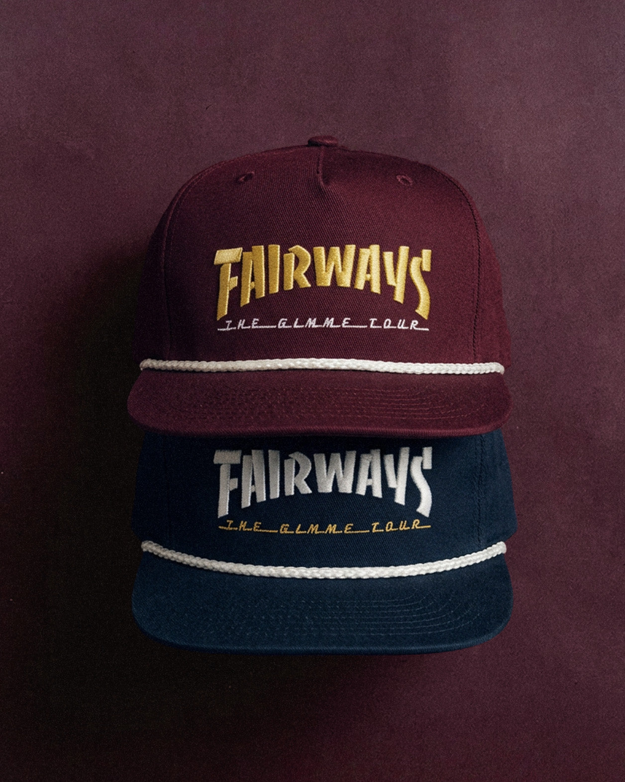 Two baseball caps with 'FAIRWAYS' branding on a dark background