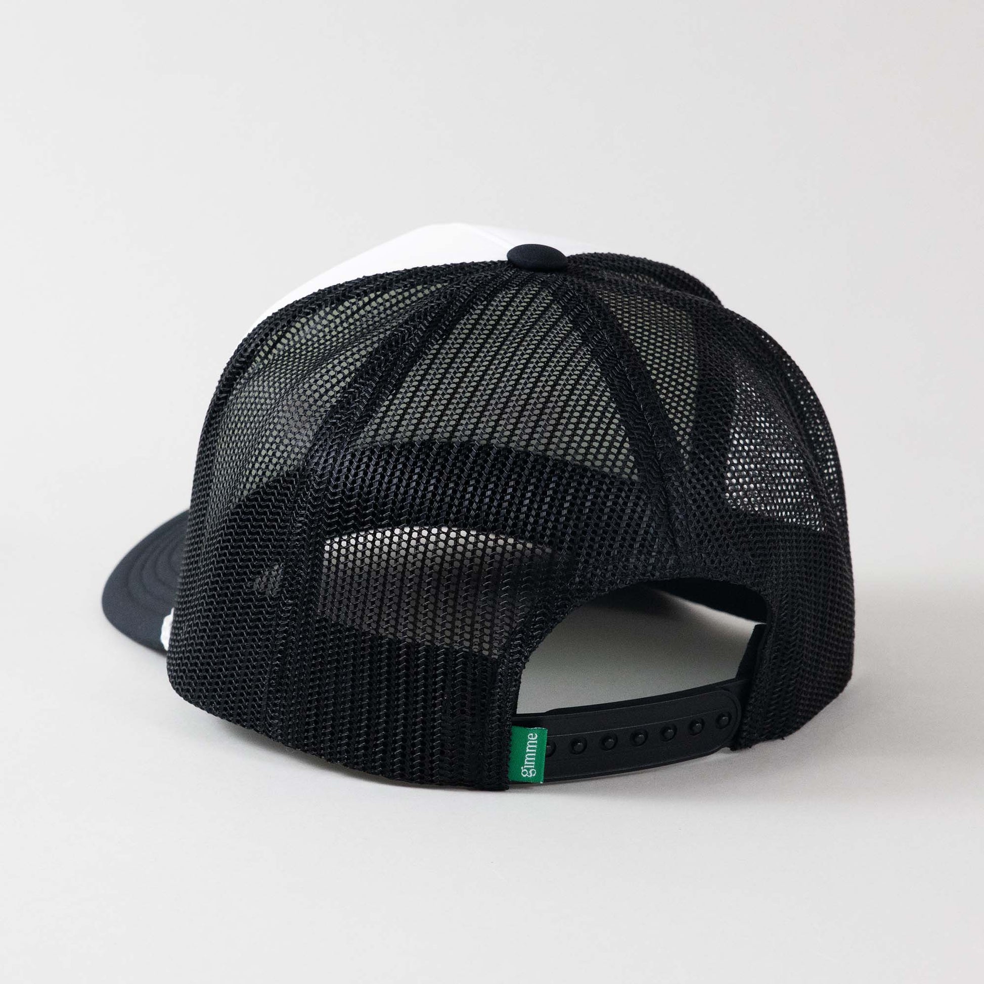 Backside view of The Gimme Tour Coke-Flakes snapback trucker hat, showing back details such as a gimme labeled patch and size adjustment – A Sort of Golf Company.