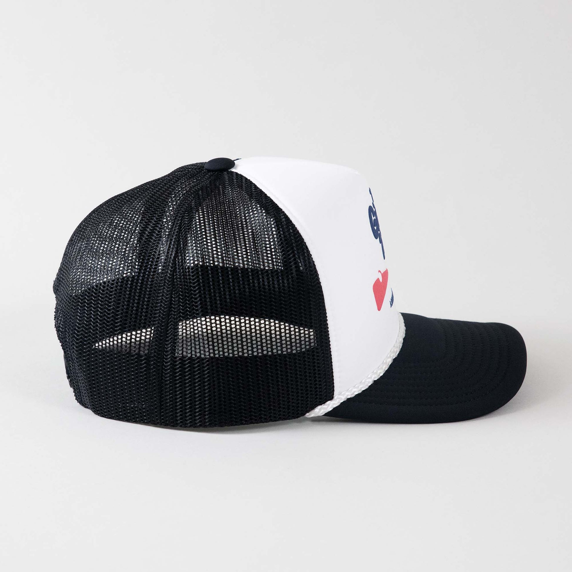 Side view of The Gimme Tour Coke-Flakes snapback trucker hat, showing side details – A Sort of Golf Company.
