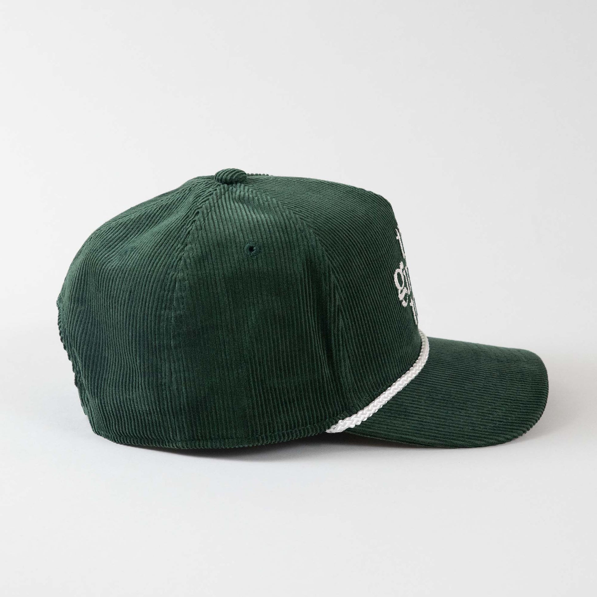 Side view of The Gimme Tour Corduroy adjustable baseball cap, showing side details – A Sort of Golf Company.