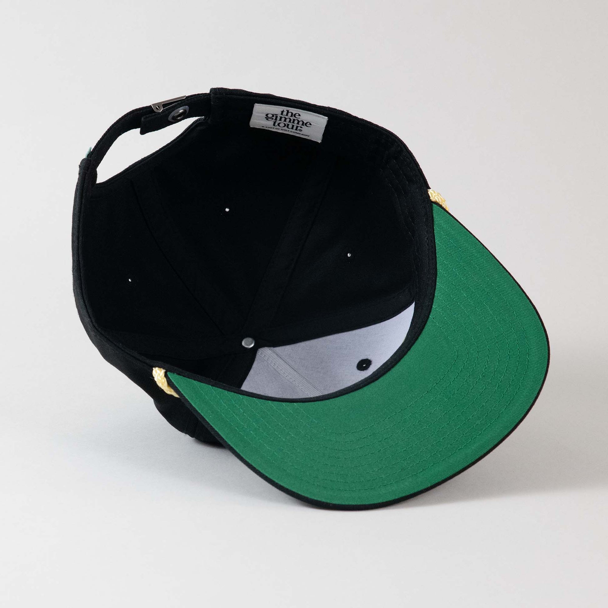 Underside view of The Gimme Tour Fairways Deadstock adjustable hat, showing inner details and branded taping – A Sort of Golf Company. 