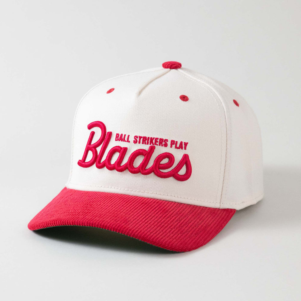 Front view of The Gimme Tour Play Blades snapback golf cap, showing details such as a Blades puffy embroidery – A Sort of Golf Company.