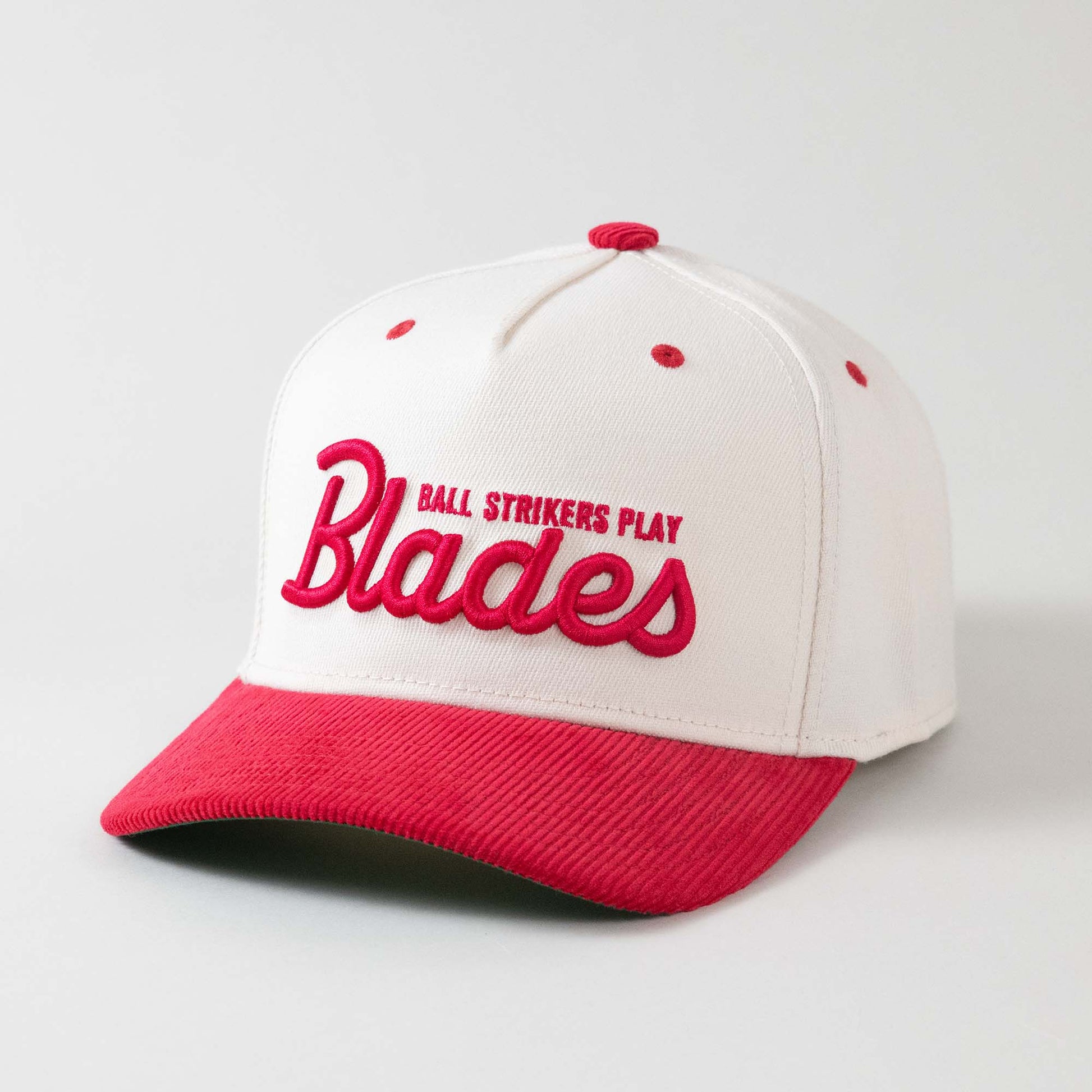 Front view of The Gimme Tour Play Blades snapback golf cap, showing details such as a Blades puffy embroidery – A Sort of Golf Company.