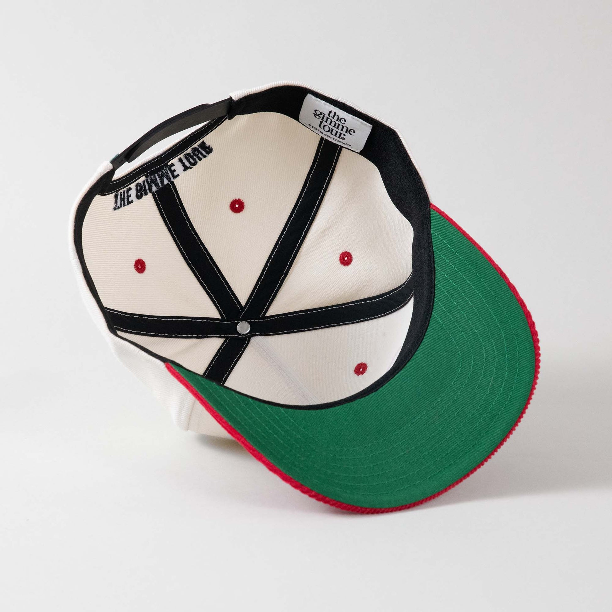 Underside view of The Gimme Tour Play Blades snapback cap, showing inner details and branded taping – A Sort of Golf Company.