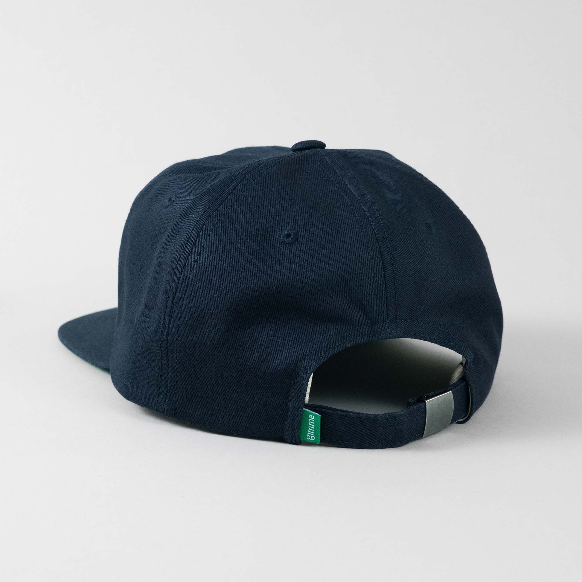 Backside view of The Gimme Tour felt lettering vintage fit adjustable cap, showing back details such as a gimme labeled patch and size adjustment – A Sort of Golf Company.